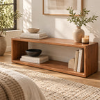 Angled view of the brown open-frame bench with books and a vase on top.