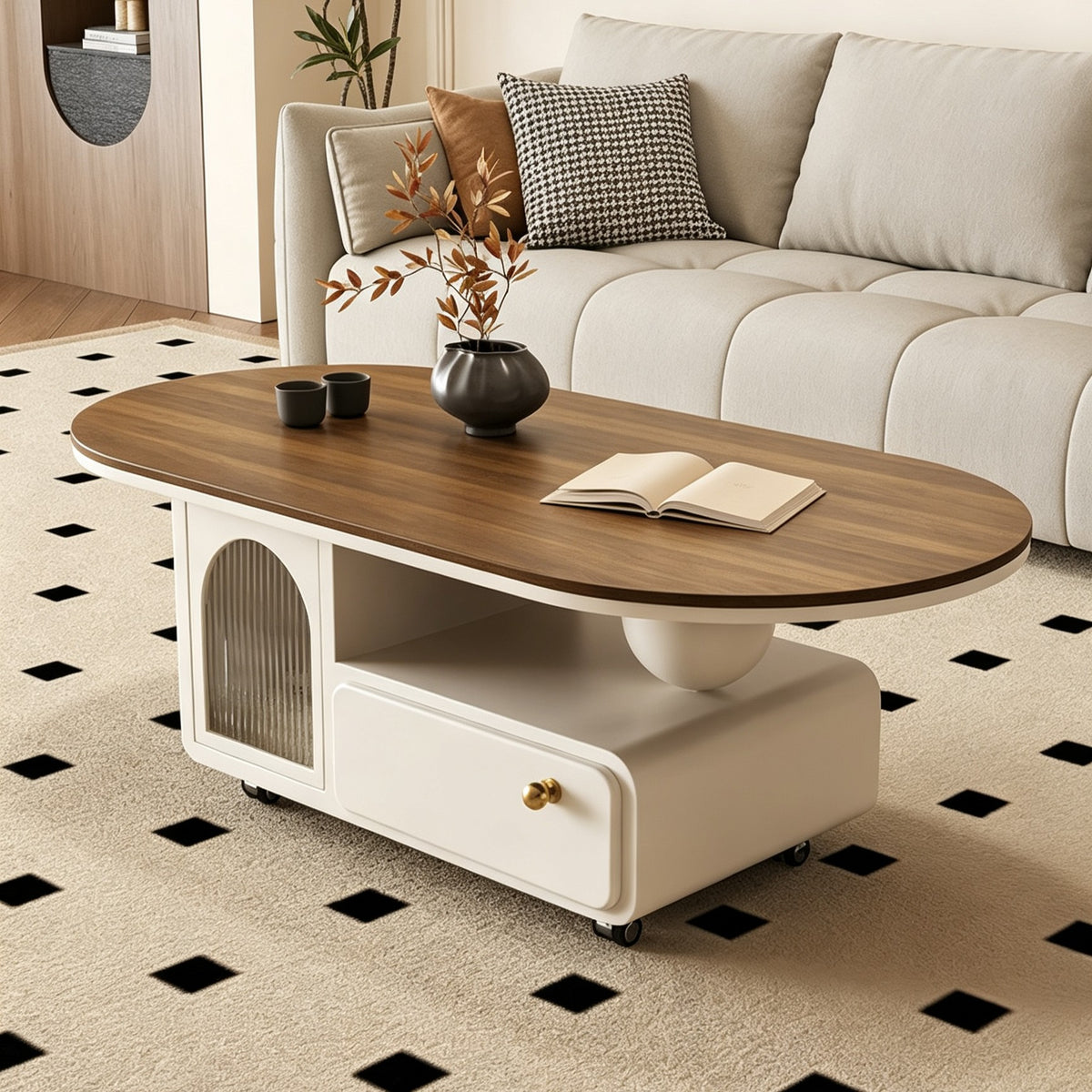 Brown-top oval coffee table with a cream storage base, arched glass door and gold-tone drawer knob.