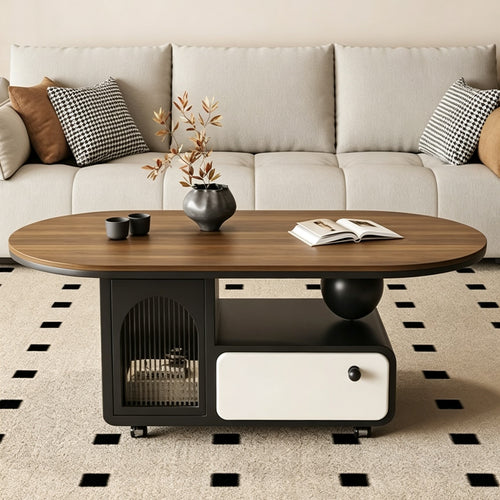 Oval brown-top coffee table with a dark storage base, arched glass door, cream drawer and ball support.