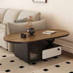 Angled view of the oval storage coffee table with a ribbed-glass door and cream drawer front.