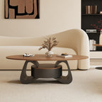 Front view of the oval coffee table with an open curved frame around its central drawer unit.