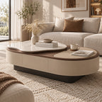 Angled room view of the oval coffee table with a raised white veined top and beige inset surface.