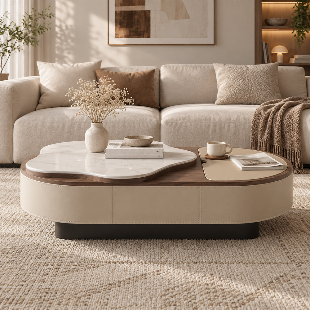 Front view of the oval coffee table with a stitched beige base, dark plinth and layered tabletop.