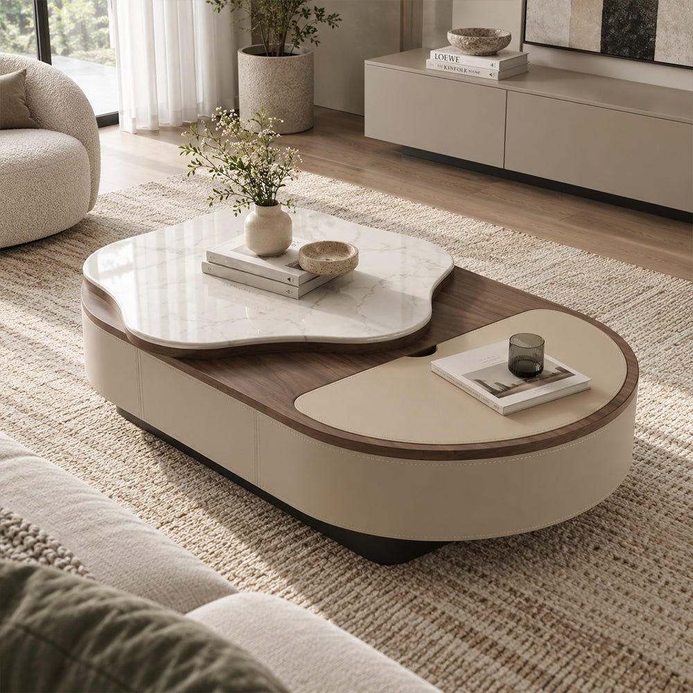 Oval coffee table with a beige curved base, brown top and raised white veined panel with an irregular rounded outline.