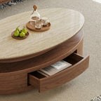 Close-up of the coffee table's open curved drawer beneath the light oval tabletop.