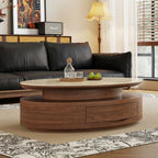 Angled room view of the oval coffee table with a light top, recessed middle tier and curved brown drawer base.