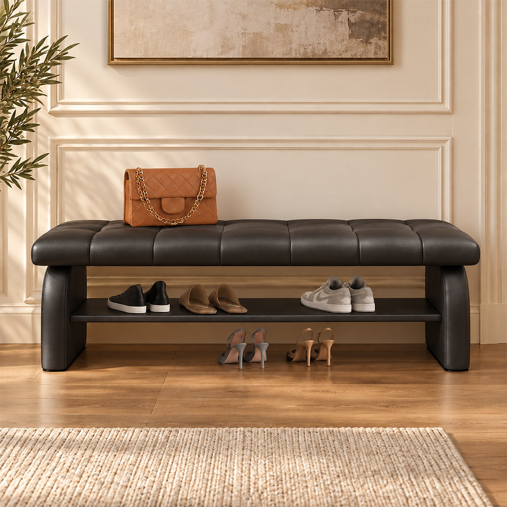 Front view of the black upholstered shoe bench with shoes on its open lower shelf.