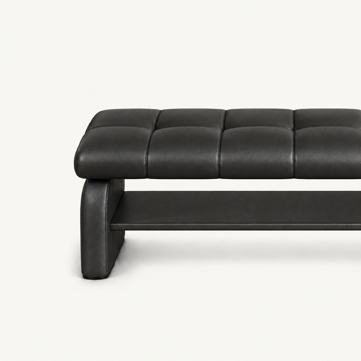 Close-up of the black bench's stitched cushion, left side support and lower storage shelf.