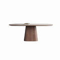Oval pale-top dining table with a single broad tapered wood-tone pedestal on a white background.