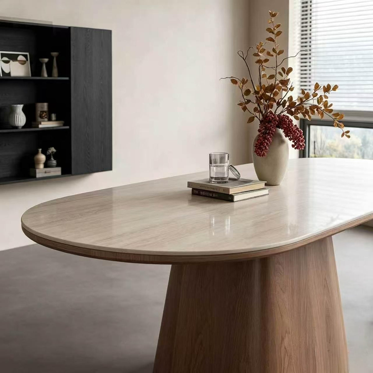Close-up of the pale patterned oval tabletop and rounded wood-tone edge.