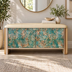 Front view of the storage bench with turquoise and brown patterned doors beneath a beige upholstered seat.