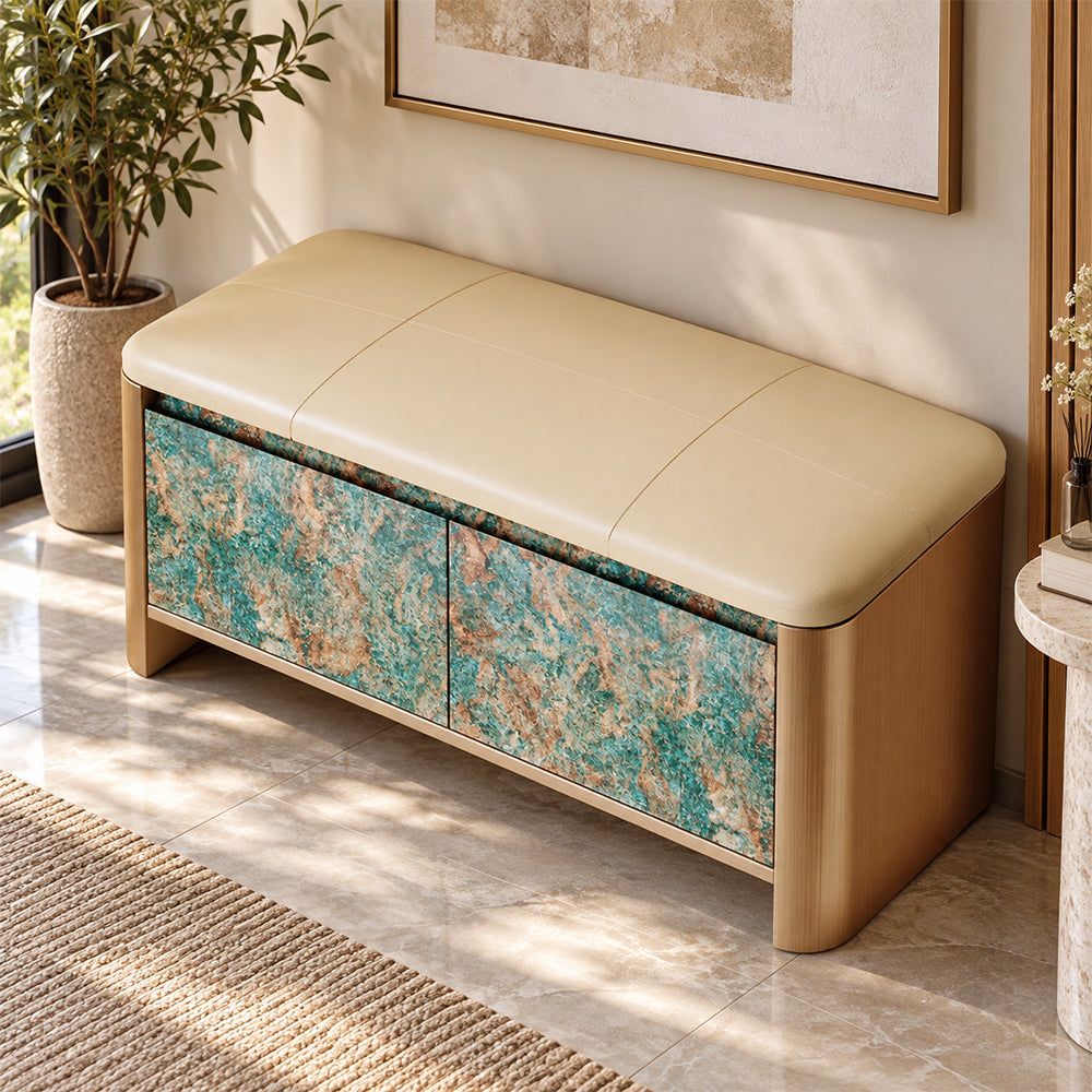 Angled overhead view of the beige padded bench seat above turquoise and brown patterned cabinet doors.