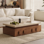 Rectangular coffee table with a pale top and brown drawer base, styled in front of a cream sofa.
