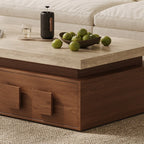 Detail of the coffee table's thick pale top, recessed upper frame and brown drawer front.