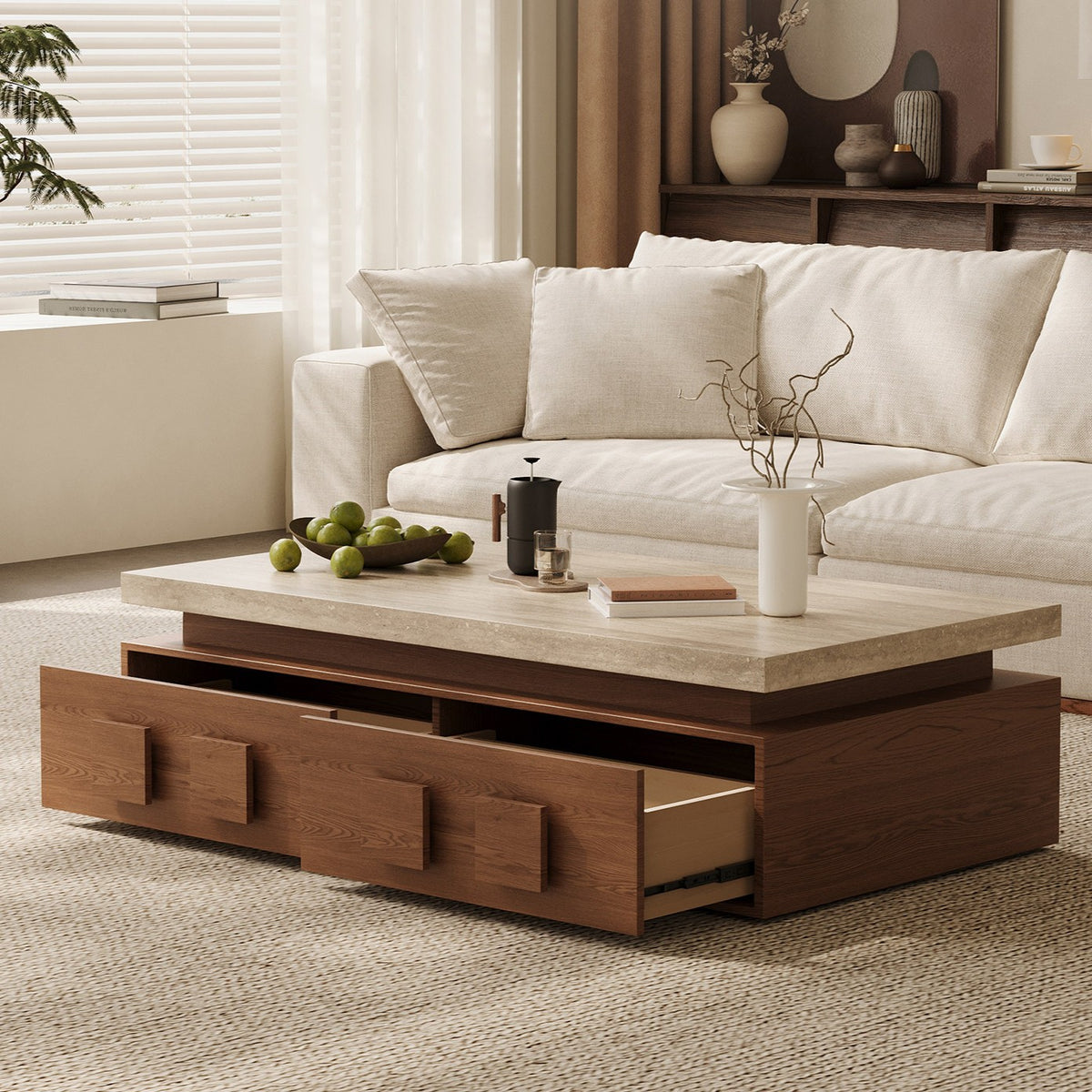 Brown coffee table with its broad front drawers open beneath a pale rectangular top.