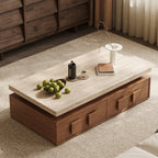 Angled overhead view of the pale-top coffee table and brown drawers with block-shaped handles.