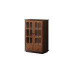 Shorter narrow display cabinet with ribbed-glass double doors, lower drawers and dark sides.