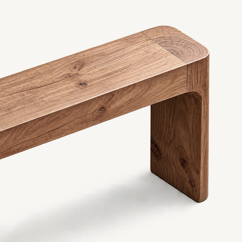 Close-up of the console table's brown grain-patterned top and rounded corner.
