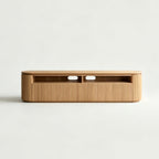 Front view of the wood-tone TV stand with rounded corners, ribbed storage fronts and two open media compartments.