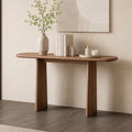 Brown version of the rounded-top console table with two tapered legs, styled against a pale wall.