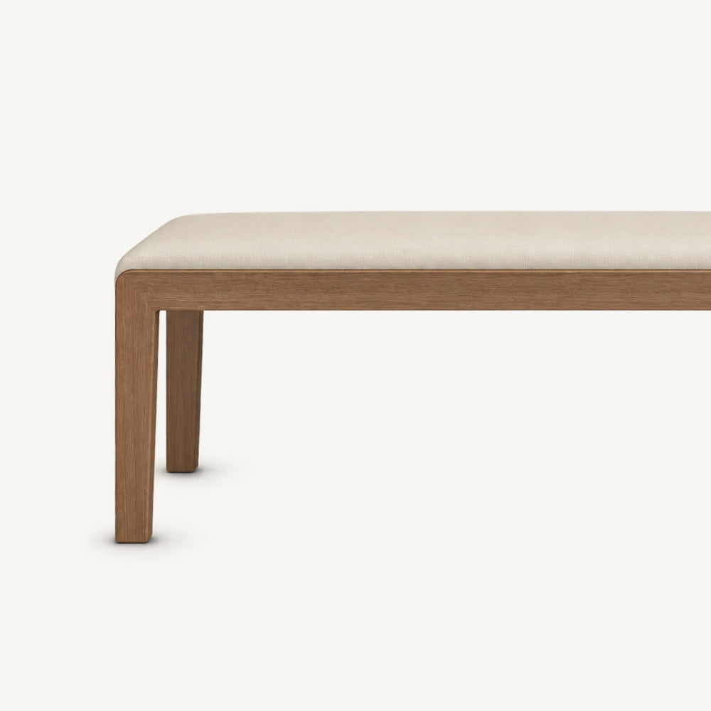 Front detail of the cream bench cushion, narrow brown apron and straight legs.