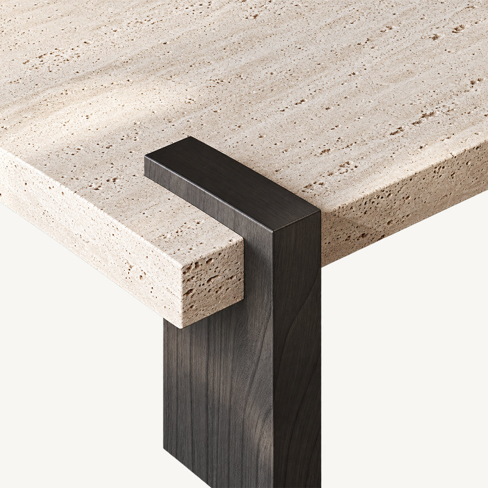 Overhead detail of a dark brown support wrapping over the light speckled square tabletop edge.
