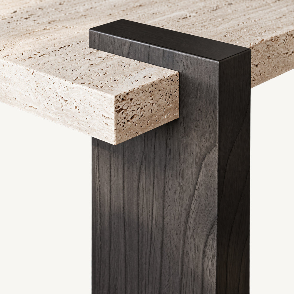 Close-up of the coffee table's dark brown block leg and projecting light speckled tabletop corner.