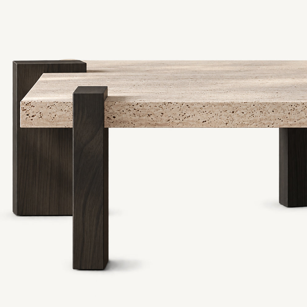 Side detail of the square coffee table's thick light speckled top and dark brown supports.