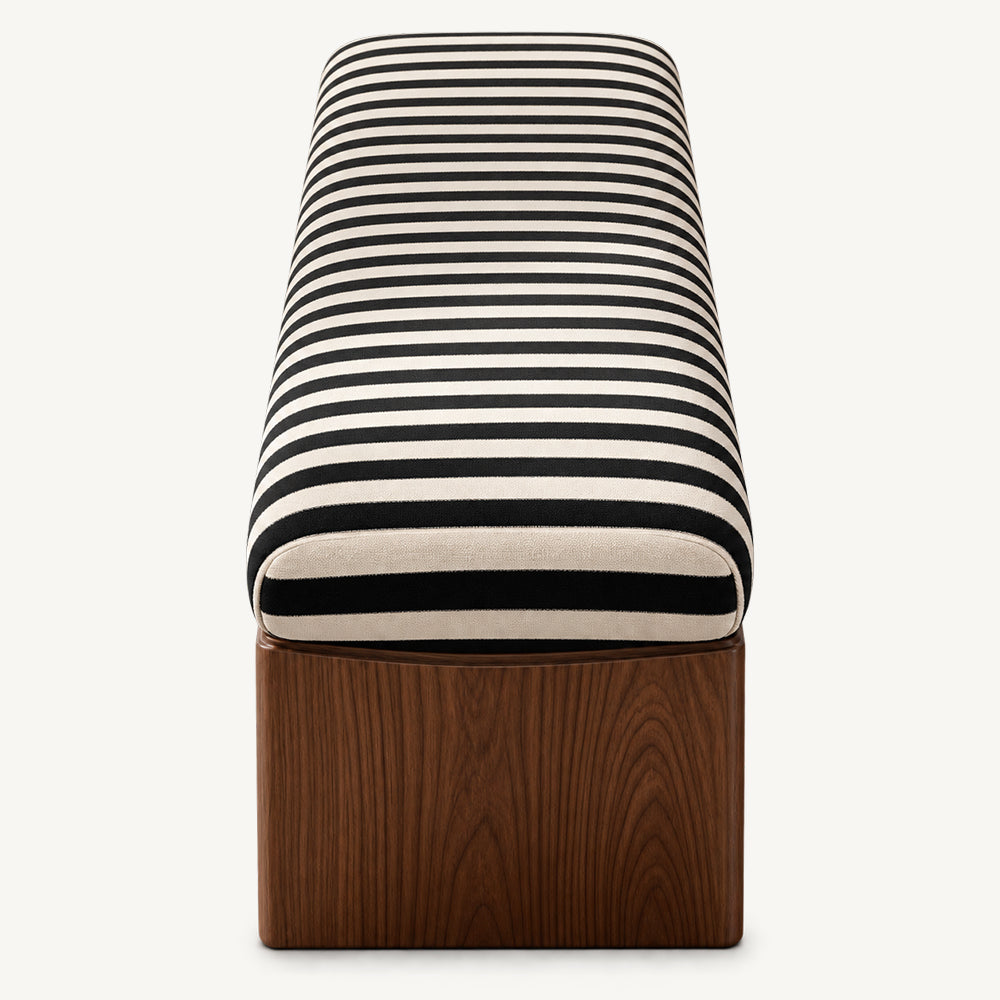 Straight end detail of the striped bench cushion and broad wood-grain leg.