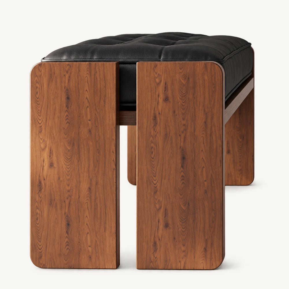 End view of the bench showing two brown leg panels separated by a narrow gap beneath the black cushion.