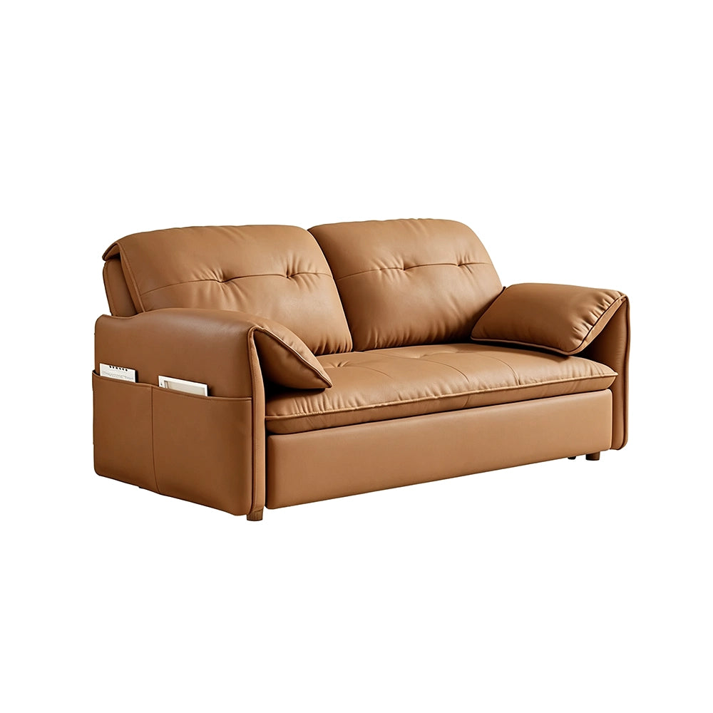 Caramel-brown sofa bed in sofa form with tufted back cushions and gold-tone feet on a white background.