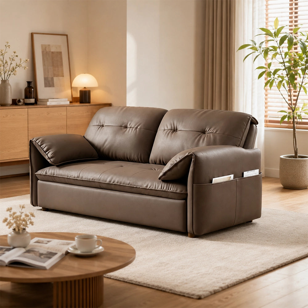 Angled view of the taupe-brown sofa bed showing its curved arm and outer side pocket.