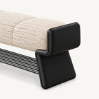 Angled close-up of the cream bench cushion and shaped black side support.