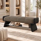 dark taupe upholstered shoe bench with black side supports, shown with shoes and boxes on its lower rack.