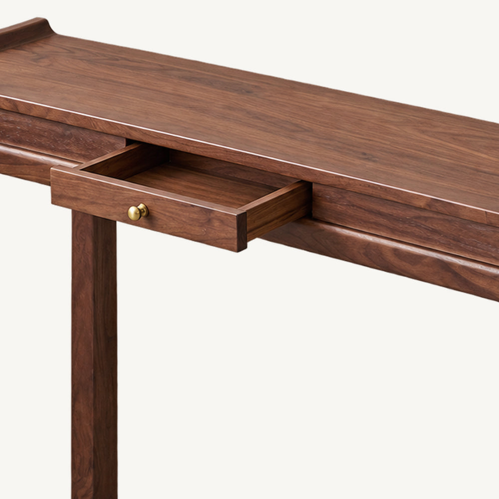 Close-up of the console table's open center drawer beneath the narrow wood-grain top.