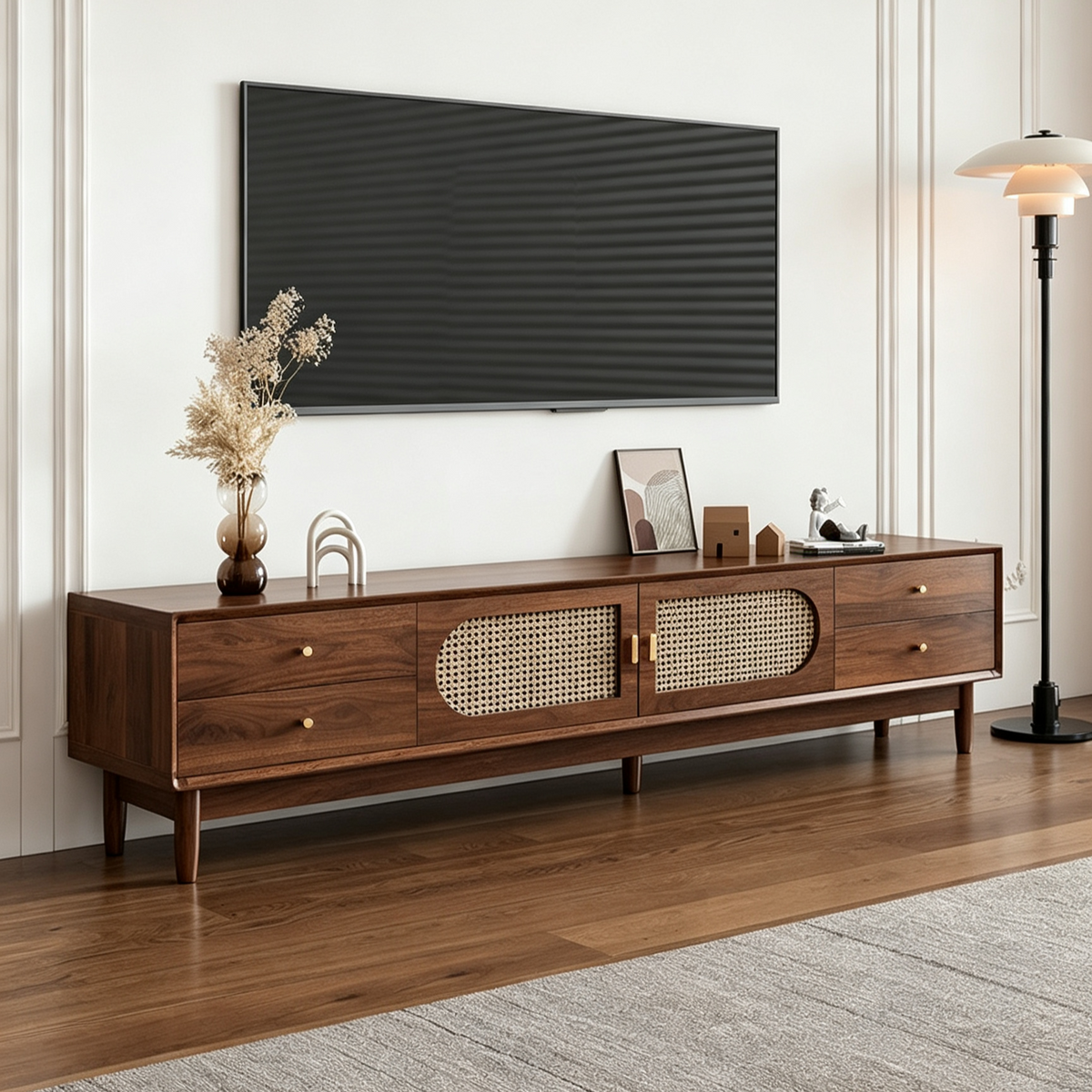Extended brown TV cabinet with woven-pattern doors and round drawer knobs in a bright room.